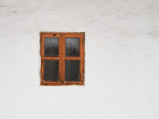 Old wooden window on a white wall background