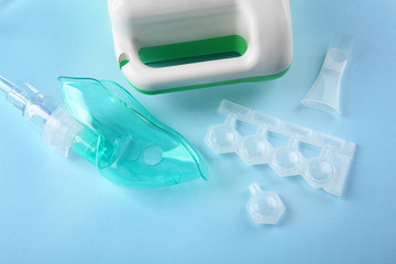 Ampoules with remedy for inhalation therapy on color background