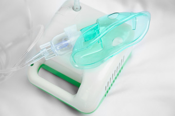 Compressor nebulizer with mask on white background