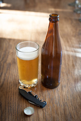 beer bottles and a glass on a table