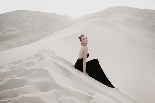 Fashion photo shoot of beautiful sexy asian woman in desert