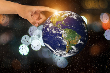 Hand with planet earth,Elements of this image furnished by NASA.