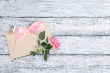 Rose flowers on background of shabby wooden planks