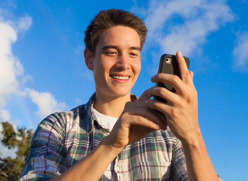 Young man using smart phone. 