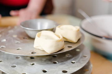 The woman molds manti. Cooking of the house, home-made food, food.