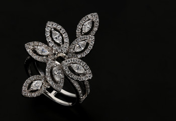 Diamond ring on black background