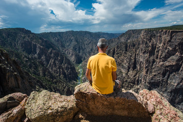 Fototapeta na wymiar Man is relaxing watching a canyon