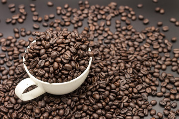 roasted coffee beans in white cup