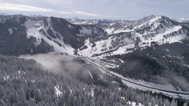 Aerial Flyback at Stevens Pass Ski Resort with Cascade Mountain Range in Background