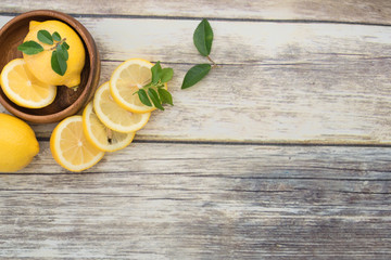 Lemons in  a wooden bowl