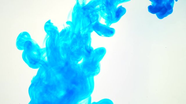 ink poured into water slow motion