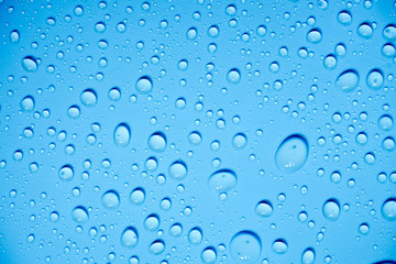 Water drops on blue background.