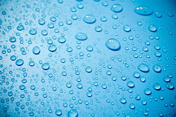 Water drops on blue background.