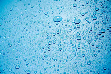Water drops on blue background.