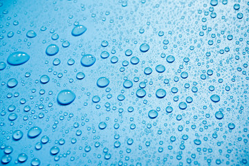 Water drops on blue background.