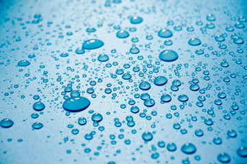 Water drops on blue background.