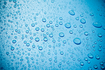 Water drops on blue background.