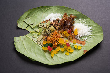 Ingredients of indian traditional digestive meetha masala paan which is a mouth freshener and...