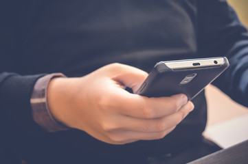 business man holding smartphone