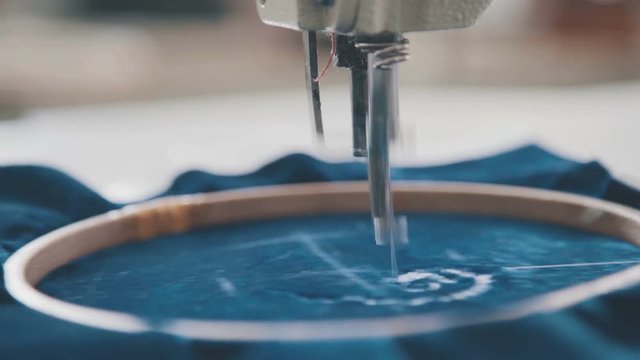 Embroidery machine needle in Textile Industry at Garment Manufacturers. Machine embroidery is an embroidery process whereby sewing machine or embroidery machine is used to create patterns on textiles