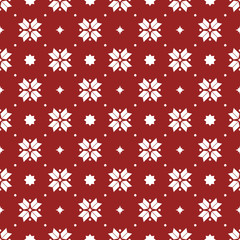 Vector seamless pattern of geometric snowflakes. Nordic pattern in Christmas traditional colors.