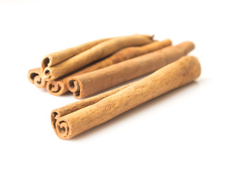 Cinnamon sticks on white background, Raw material cooking food, selective focus