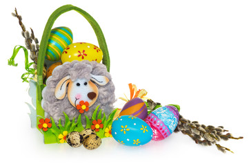 Obraz premium Basket with easter eggs and catkins. Easter basket made of felt.