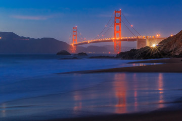 Golden Gate Bridge in San Francisco from Baker Beach at sunset