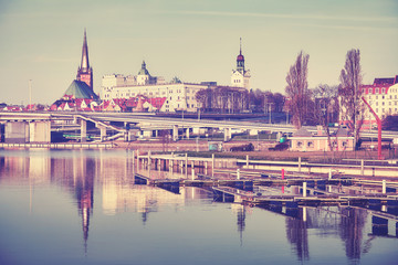 Vintage stylized Szczecin city waterfront and marina in the morning, Poland.