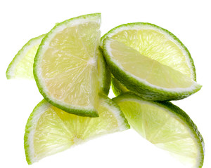 Slices of lime on white background