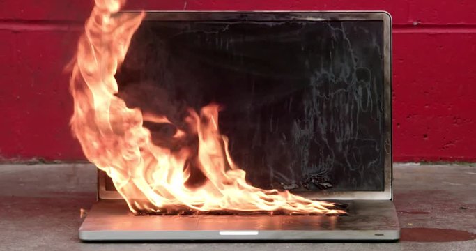 Laptop computer on fire and burning intensely