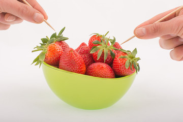 strawberries in a green bowl
