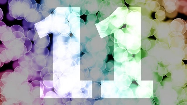 Eleven to twelve years birthday fade in/out animation with color gradient moving bokeh background. Animation: 90 frames still with number, 180 fade out, 30 clear, 180 fade in, 300 still.