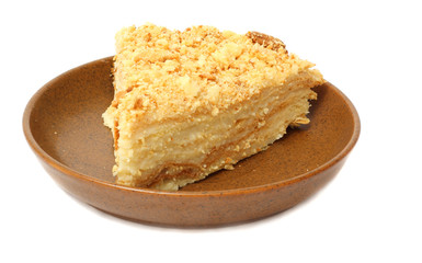 cake napoleon on plate isolated on white background