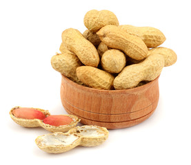 peanuts in wood plate isolated on the white background