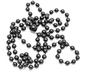 Black beads on a white background