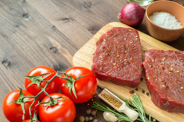 raw beef steak with ingredients for cooking