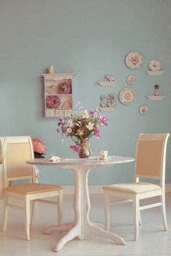 dining room interior with flowers decorative plates