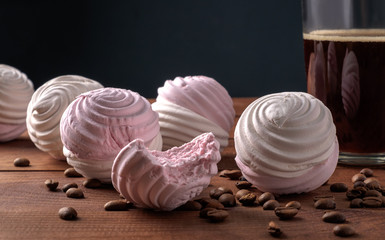 White and pink zephyr with a cup of coffee