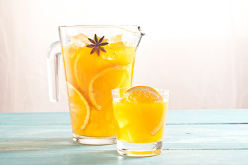 Orange juice glass and carafe.