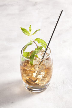 Alcohol cocktail with mint leafs.