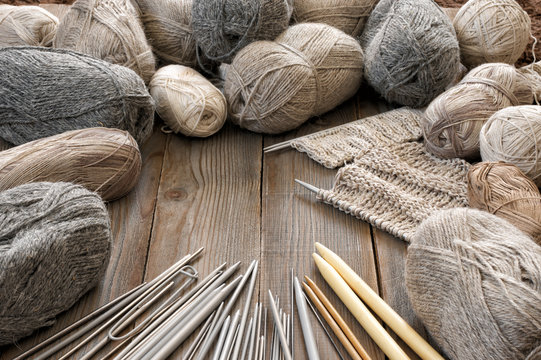 Various neutral colored yarn and needles