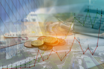 Double exposure of city, graph, banknote and coins money for finance and business concept