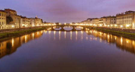 The Arno River flowing through Florence at sunrise.Italy