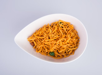 murukku or traditional indian snack chakli and chakali on background.