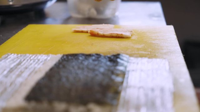 Chef prepares sushi rolls, cooking. Close-up. 4k footage.
