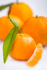 Ripe mandarin close-up on a white background. Tangerine orange. Colorful Food and drink still life concept. Fresh fruits. Clementine. Citrus. Diet. Vitamins. Healthy food.