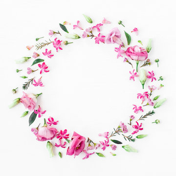 Flowers composition. Wreath made of various pink flowers on white background. Flat lay, top view