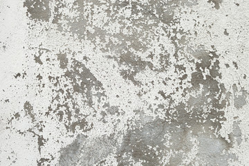 Texture of old light wall with peeling white paint