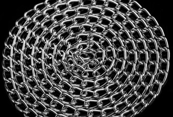 Chain heap - abstract metal background. Collection silver jewelry chains on an isolated black...